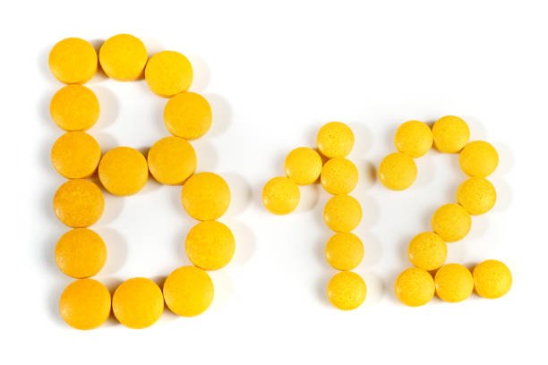 A plate of foods rich in Vitamin B12, including fish, eggs, and dairy products.