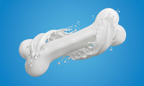 A bowl of assorted dairy products like cheese, yogurt, and milk with a calcium supplement tablet nearby.