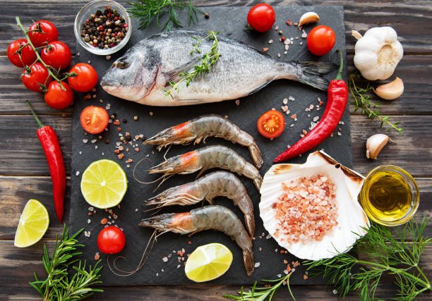 Fresh, whole fish with shiny scales and vibrant colors on ice.